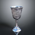Silver Decorative Goblet With Carved Floral Patterns And Elegant Base Design
