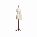 Cream Colored Garment On Wooden Dress Form With Black Tailoring Lines