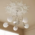 Ornate White Ceiling Medallion Silver Metal Chandelier With White Glass Balls On Beige Room Corner