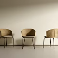 Three Modern Woven Dining Chairs With Black Metal Legs In Light Room