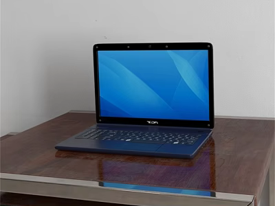 Open Dell Laptop With Blue Screen Display On Wooden Table Surface 3d model