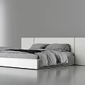 Modern Double Bed With Minimalist White Headboard And Gray Bedding in Contemporary Bedroom