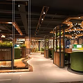 Modern Internet Cafe Interior Design With Green Armchairs Wooden Desks And Hanging Lights