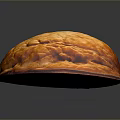Whole Brown Walnut With Natural Textured Surface And Shiny Appearance On Dark Background