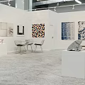 Modern Art Gallery Featuring Various Paintings Sculptures On Pedestals Tables Chairs And Gray Floor