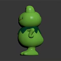 Green Cartoon Frog Toy with Big Eyes Smiling and Leaf Collar Standing on Dark Background