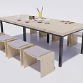 Kids Table with Wooden Top Metal Legs Stools Gray Cushions Colorful Cups Brushes