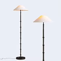 Two Modern Floor Lamps With Black Metal Poles And White Conical Shades