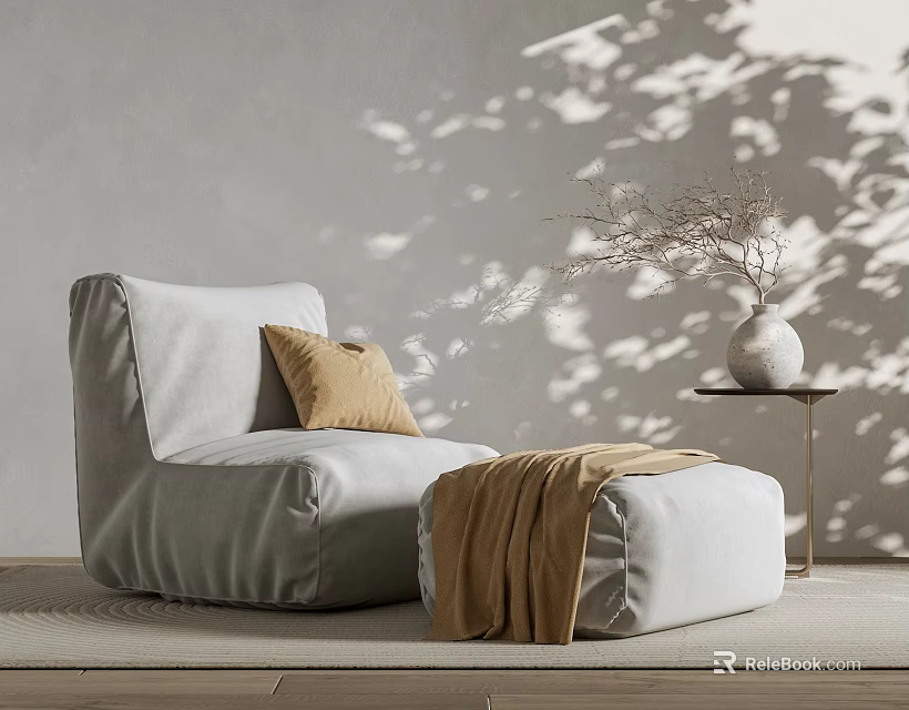 Gray Bean Bag Chair With Beige Cushion Brown Blanket Ottoman Side Table And Dried Branches 3d model 