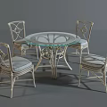 Round Glass Top Outdoor Table With Four Wicker Chairs And Gray Cushions