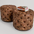 Brown Round Tufted Leather Ottoman Stools With Stack Of Books And Decorative Design