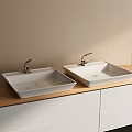 Two White Square Washbasins On Wooden Countertop With White Cabinet Below