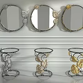 Decorative Round Mirrors With Leaf Accents In Silver And Gold On White Wall