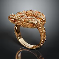 Elegant Gold Ring With Intricate Filigree Design And Red Gemstone Accents