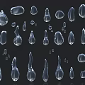 Transparent Teardrop Shaped Objects In Various Sizes And Forms On Black Background