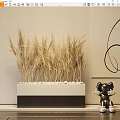Golden Wheat Ears in White Container with White Pebbles Beside Black Decorative Lines and Sculpture