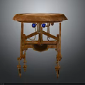 Round Top Orange Wooden Table With Unique Carved Legs And Blue Decorative Accents