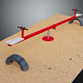 Outdoor Red Seesaw With White Seats Black Handles In Sand Playground With Tires And Footprints