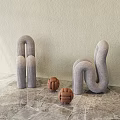 Gray Knitted Lazy Sofa Curved Design With Brown Woven Balls On Beige Wall Marble Floor