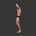 Shirtless Muscular Man Flexing Biceps in Black Underwear on Gray Background