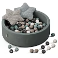Children's Bed With Round Ball Pit Filled With Colorful Balls And Star Shaped Cushions