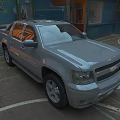 Silver Chevrolet Pickup Truck Parked In Urban Parking Lot With Graffiti Wall Background