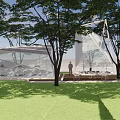Modern Landscape Pavilion Featuring Geometric Glass Structure Green Lawn Trees And Clear Sky