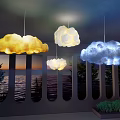 Yellow White Blue Cloud Shaped Pendant Lights Hanging Over Indoor Sea View Window
