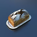 Freshly Baked Artisan Bread with Flour Dust and Cracked Surface on White Patterned Plate