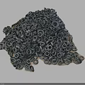 Tire Sculpture With Stacked Tires And Green Plants On Dark Background