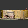 Layered Yellow Cake with Sliced Cream Filling and Petal Toppings on White Plate with Knife