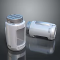 Two Sleek Silver Metal Containers With Modern Design Lid And Textured Surface