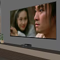 Large Screen Television Mounted On Wall In Living Room With Media Player And Wooden Floor