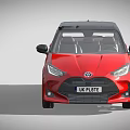 Red Toyota Hatchback With Black Roof UK License Plate And Alloy Wheels