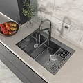 Stainless Steel Kitchen Sink With Faucet And Drainer Rack On Countertop