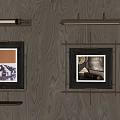 Elegant Wall Decor With Framed Artworks And Sconce Lighting On Wooden Panel