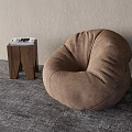 Brown Plush Bean Bag Chair With Wooden Side Table And Magazine In Indoor Space