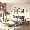 Double Bed with Black Leather Headboard White Floral Sheets and Wooden Nightstand