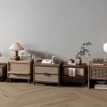 Various Wooden Bedside Tables With Rattan Details And Table Lamps Featuring Small Plants