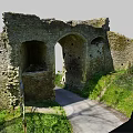 Ancient Stone Arch Ruins In Countryside With Green Grass And Pathway
