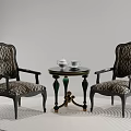 Two Vintage Leisure Chairs With Patterned Fabric Black Frame And Round Table On White Rug