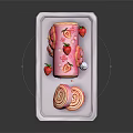 Pink Swiss Roll Cake with Strawberries and Flower Decorations on White Tray Showing Swirled Interior