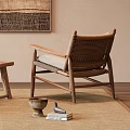 Light Tone Leisure Chairs With Wooden Frame Woven Details Near Small Table And Decorative Art