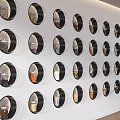 Exhibition Hall Culture Wall Featuring Circular Display Windows and Arranged Items on White Wall