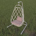 White Woven Swing Chair With Pink Cushion In Green Grass Field