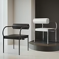 Modern Single Chair Featuring Black and White Cylindrical Backrest Metal Frame in Minimalist Setting