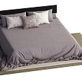 Modern Double Bed with Black Headboard Gray Bedspread and Decorative Pillows on Woven Rug