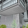 Modern High Rise Office Building With Glass Curtain Walls Connected Towers And Landscaped Areas