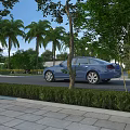 Blue Sedan Parked Along Scenic Roadside With Palm Trees Lush Greenery And Sidewalk
