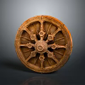 Ancient Wooden Wheel With Intricate Carved Spokes And Decorative Design